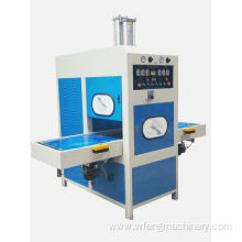 Sliding table high frequency welding and embossing machine